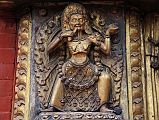 Kathmandu Bhaktapur 04-4 Bhaktapur Durbar Square Golden Gate Emaciated Deity Close Up An emaciated tantric deity flanks the door of the Golden Gate in Bhaktapurs Durbar Square.